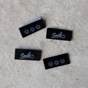 Van schie raamdecoratie & stoffen 10 Loop&label - smile - zijnaadlabels (4 stuks)