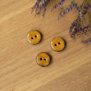 Parelmoer knoop 15mm oker