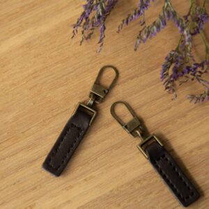 Ritstrekker leer donkerbruin/brons