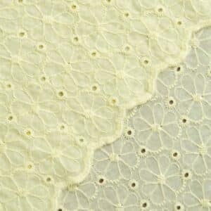 Poplin broderie bloemen schulprand geel